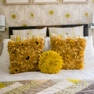 Yellow Floral Cushions on Bed in En Suite Double